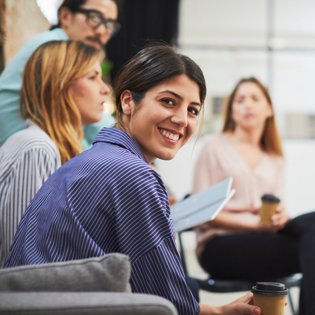 Team member looking back at camera during meeting.