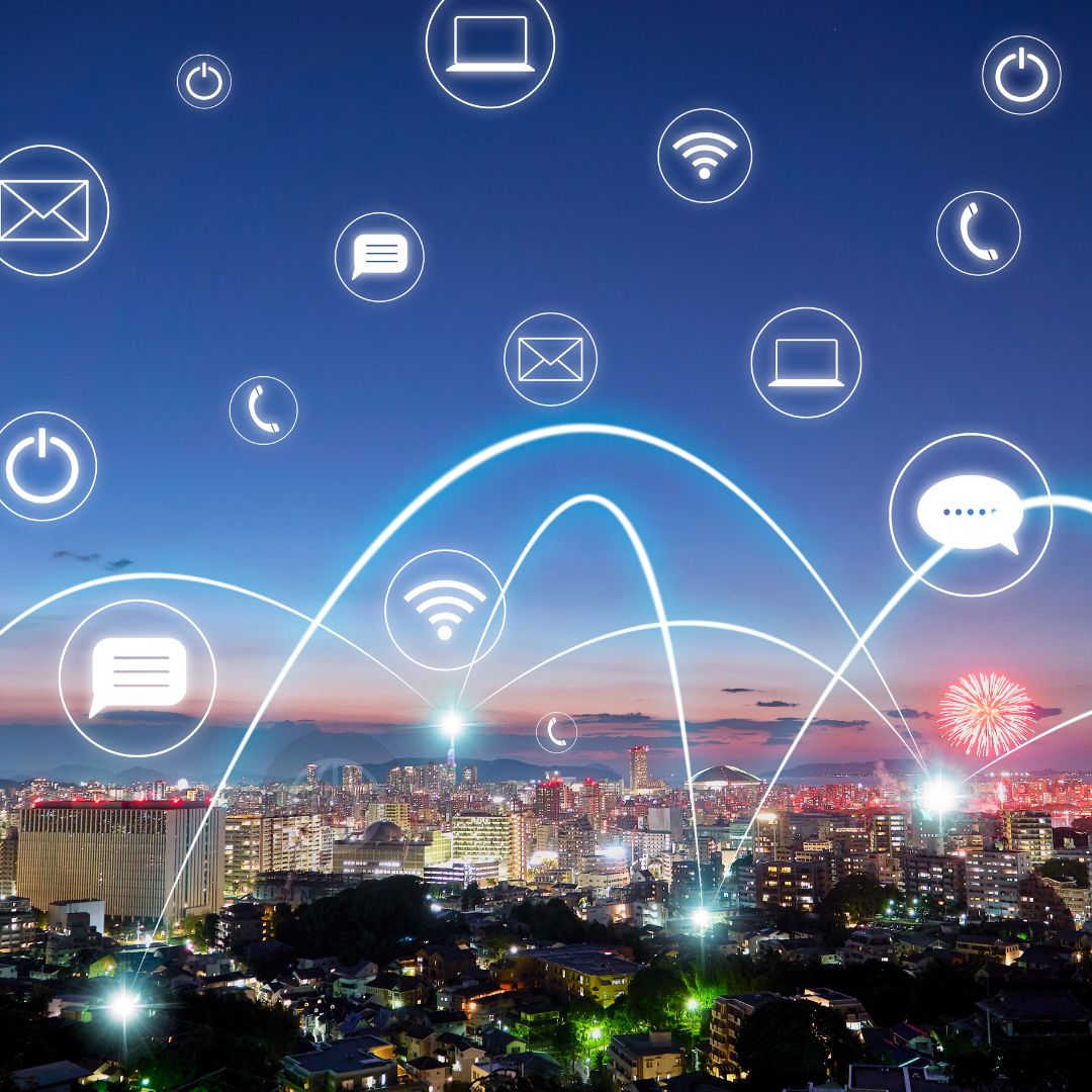 Image showing a photo of a city skyline with white lines and communication icons showing connectivity.